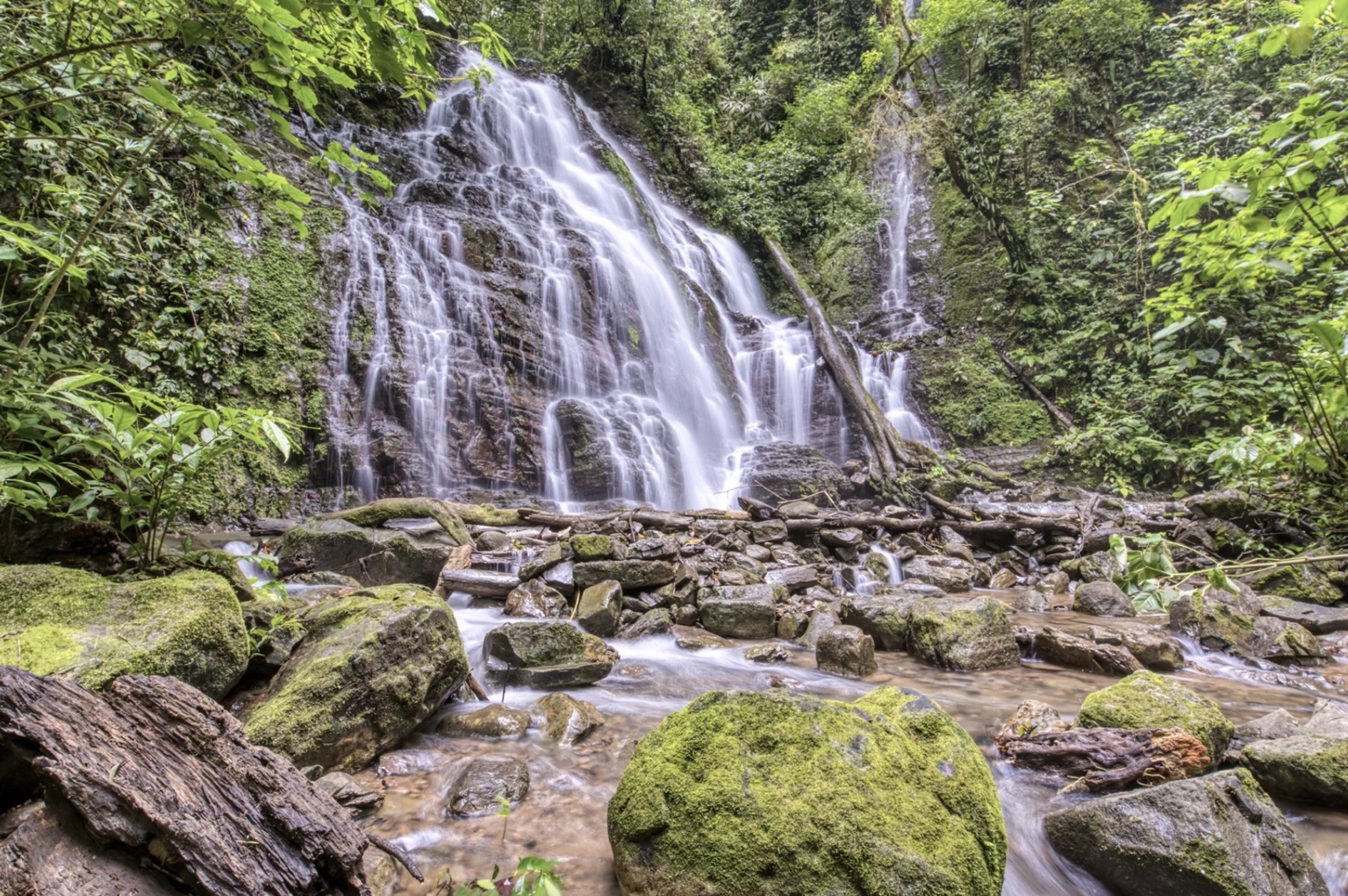 Waterfall flowing through the rainforest